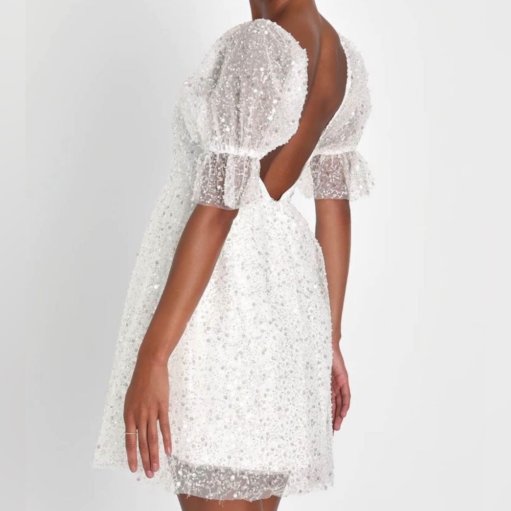 White sequence and pearl dress
